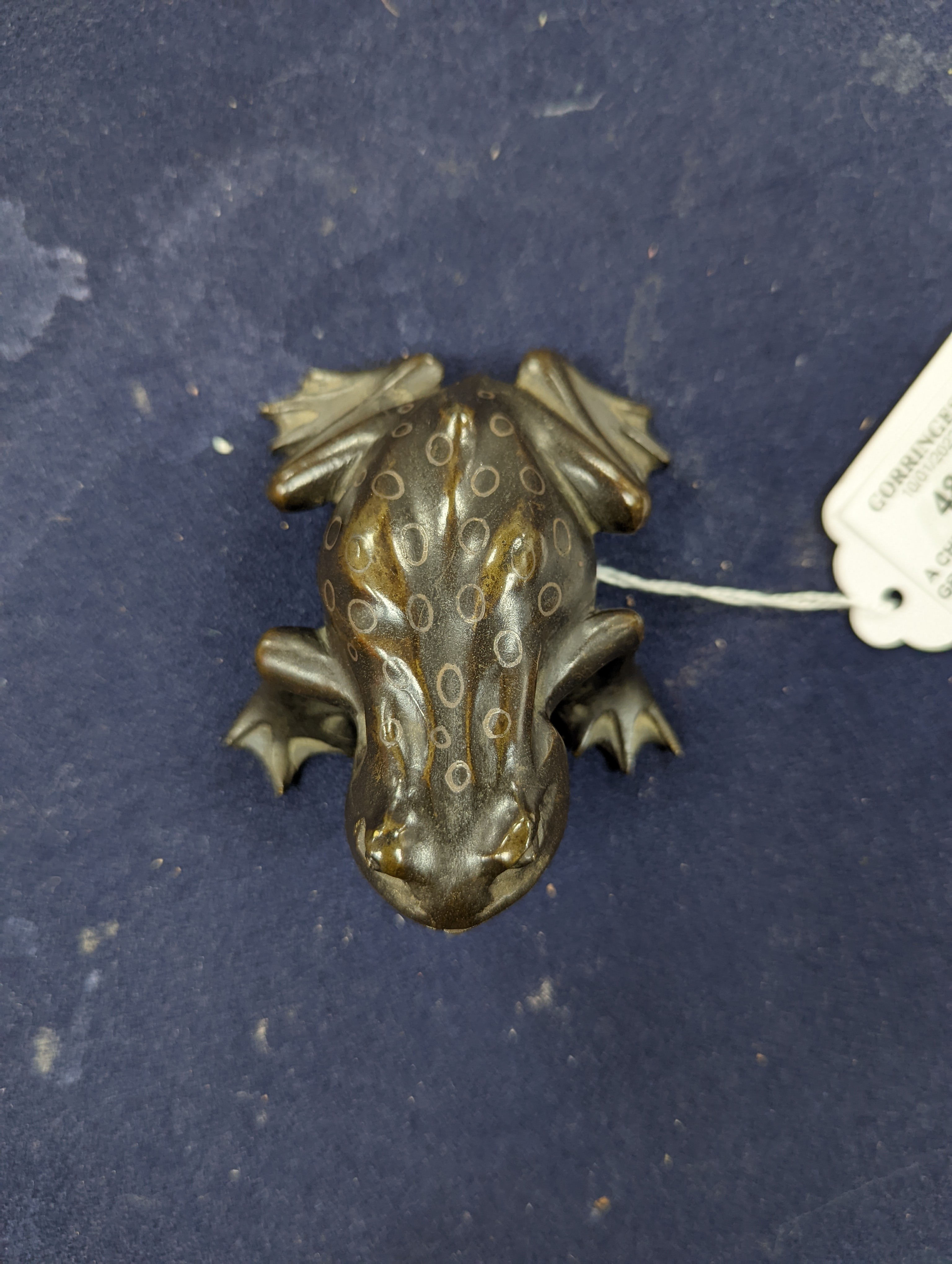 A Chinese bronze group of Liu Hai and a toad, wood stand and a bronze figure of a dog, 9cm